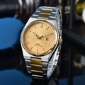 Macro detail of gold textured dial with date window and two-tone steel band for men - 25-Two-tone Gold Dial