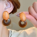 Detail of vintage geometric wood and resin drop earrings worn for an elegant look - Wood Patchwork Amber Hoop (50#) / Brown