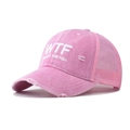 Close-up of pink distressed mesh baseball cap with WTF lettering and frayed brim detail - Pink