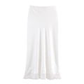 Detail of white satin midi skirt featuring delicate floral lace trim at the hemline - XS / White
