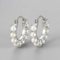 Elegant silver hoop earrings featuring multiple round white pearls on a minimalist frame - Pearl Hoop Earrings / White Gold