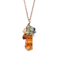 Macro shot of colorful natural stone tree of life pendant with copper wire wrap - Antique Copper + Red Agate