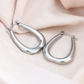 Macro detail of silver U-shaped titanium steel earrings with polished mirror finish - Smooth O-Shape / Silver