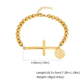 Detailed view of gold stainless steel beaded bracelet with cross and St. Benedict medal - St. Benedict Medal / Gold