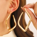 Modern gold irregular geometric twisted square earrings with a metallic polished finish - Geometric Twisted Style (3895) / 07 KC Gold