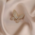 Elegant gold butterfly brooch with shimmering pavé crystal wings on champagne silk background - 532# White Butterfly