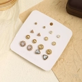 Detail of 9 pairs golden stud earring set featuring rhinestones and various geometric shapes - Set 4 (Round + Triangle)