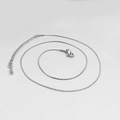 Detailed macro view of silver stainless steel chain necklace with lobster clasp - Silver Wire Chain