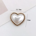 Detailed macro view of 13.5mm heart pearl charm with gold metal beaded edge trim - D2236 Mini Pearl Heart