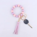 Detail of pink and purple silicone beaded bracelet keychain with rhinestones and tassel - Light Purple