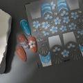 5D embossed nail art stickers with blue flowers and shell textures on various nail tips - Blue White Flower Shell Style (CO-519)