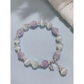 Detail of beaded bracelet with purple cat-eye stones, silver flower beads and star charm - Purple (Eco-friendly)