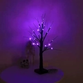 Halloween black birch tree with purple LED lights on a table with skull decor - 24 LED Black Tree - Purple Light / 24 Lights