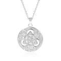 Macro shot of a silver circular hollow pendant with an intricate Celtic knot on white surface - Steel