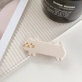 Pink cat-shaped acetate hair clip with gold facial details on a lifestyle background - Light Pink