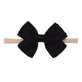 Soft nylon baby headband featuring a black cable knit bow and beige elastic band - Black