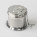 Macro shot of SUS 304 stainless steel tea infuser ball with fine mesh and hanging chain - Plus Size Regular Style + Base