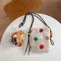 Close-up of plush off-white crossbody bag with colorful dots and woven cord strap - Colorful Polka Dots