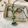 Collier ethnique en céramique avec pendentif étoile de mer verte et glands de perles - Étoile en Céramique Verte