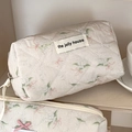 Close-up of quilted floral makeup bag with elegant green leaves and pink bows detail - Nali Elephant Octagon Pouch