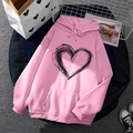 Pink fleece hoodie with black heart graphic print and drawstring detail for women and men - S / Tops / Pink