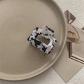 Macro detail of square acetate hair claw with black and white marble pattern and metal spring - Small Square Claw / Black & White