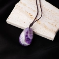 Natural teardrop amethyst pendant necklace on stone background with brown woven cord - Amethyst Teardrop Pendant