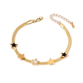 Bracelet étoile doré avec incrustations en nacre noire et blanche sur chaîne - Bracelet Pentagramme