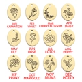 Macro view of 12 oval gold pendants featuring monthly birth flowers and month names - October-Marigold / Gold