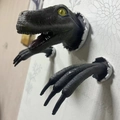 3-piece resin wall mount featuring a grey velociraptor head and claws breaking through wall - Blue
