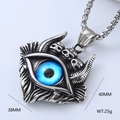 Macro shot of vintage silver evil eye pendant with 40mm x 38mm dimensions and 25g weight - Punk Blue Eyeball Style