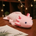 Plush pink axolotl stuffed toy resting on a wooden table with soft bokeh lighting - Type B (Prone Position) / 45cm / Pink