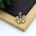 Macro shot of 18K gold plated butterfly pendant with micro-inlaid white zircons - Micro-set Butterfly Sparkling Style