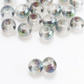 Macro shot of 8x10mm transparent glass beads with rainbow iridescent coating for DIY jewelry - Rose Red Green
