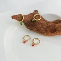 Golden stainless steel hoop earrings with green and red gemstone pendants on wood - Green Zirconia (DEK436)