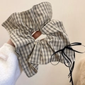 Plaid hair scrunchie with long black ribbon bow shown on a white knitted sleeve - Beige Plaid Square Scarf Style