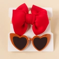Detail of red bow nylon headband and heart-shaped sunglasses on white display card - Red Set