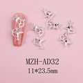Detail of silver star nail charms with 11x23.5mm size on a pink manicure display - Silver Star Chain (AD32)