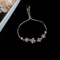 Silver adjustable bracelet with purple zircon flower and white stones on black velvet - Silver Purple Flower