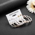 Vintage gold geometric earring set with pearls and diamonds on a white display card - E092/Atmosphere / Gold/White