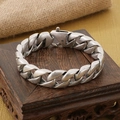 Detailed macro view of vintage silver Cuban link chain with aged metal texture on wood - Antique Silver (KB170064-KJX)