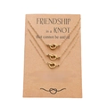 Three-piece gold knot necklace set on a brown kraft card for friendship gifts - Gold Triple Knot Necklace (N00037-1)