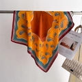 Detailed view of the orange silk scarf with paisley pattern and elegant leather belt design - One Size / Yellow