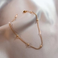 Gold titanium steel bead bracelet featuring a snake chain design on grey silk fabric - Bracelet / Rose Gold