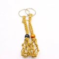 Detail view of handmade woven macrame mesh net keychains with decorative beads - 2 Pcs/Set / White Brown