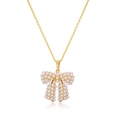 Detailed view of a gold bow pendant necklace featuring white micro-inlaid pearls - Style E-Pearl Bowknot / Gold