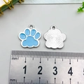 Sky blue glitter cat paw print alloy pendant shown with a ruler for size reference - Sky Blue Cat Paw (16x17mm)