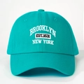 Detailed embroidery of Brooklyn New York text on teal cotton twill baseball cap - One Size / Lake Green