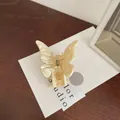 Elegant butterfly hair claw clip with ivory marble pattern for half-up hairstyles - Off White