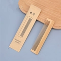 Eco-friendly bamboo hotel comb in natural wood finish with kraft paper packaging - Bamboo Comb in Paper Bag
